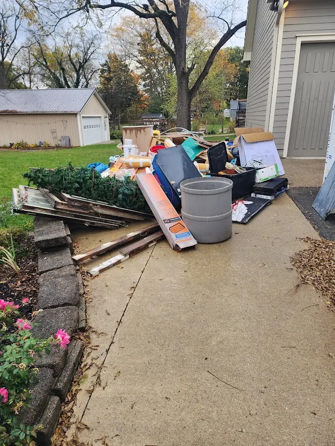 Dumpster being loaded with debris for Commercial Dumpster Rental in Parkland